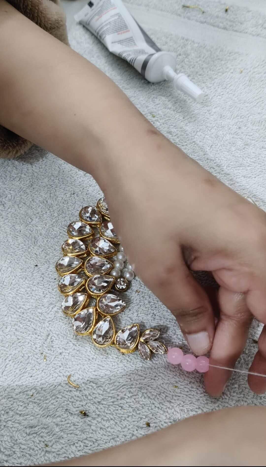 Pink beads kundan chokar taking shape when glass beads getting attached to it